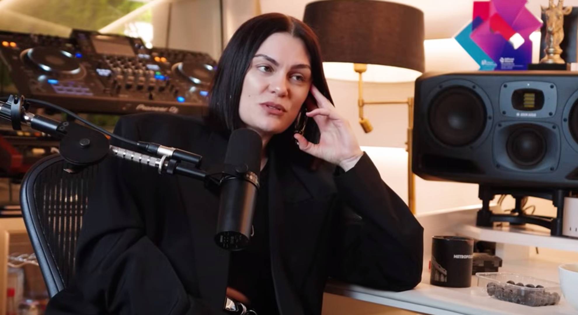 Jessie J rests her head in her hand