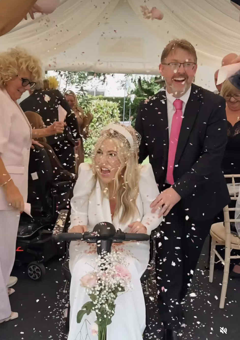 Nikki Fox and Dave being showered with confetti on their wedding day 