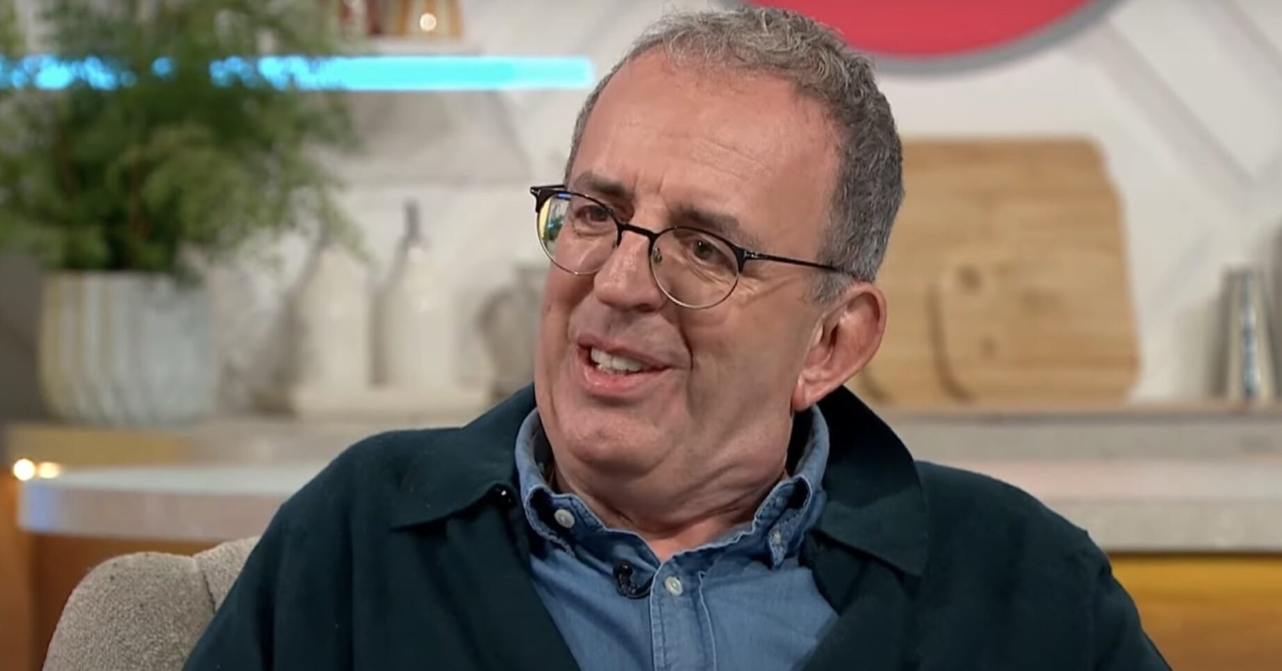 Richard Coles in a blue shirt and navy overshirt discussing weight loss on Lorraine