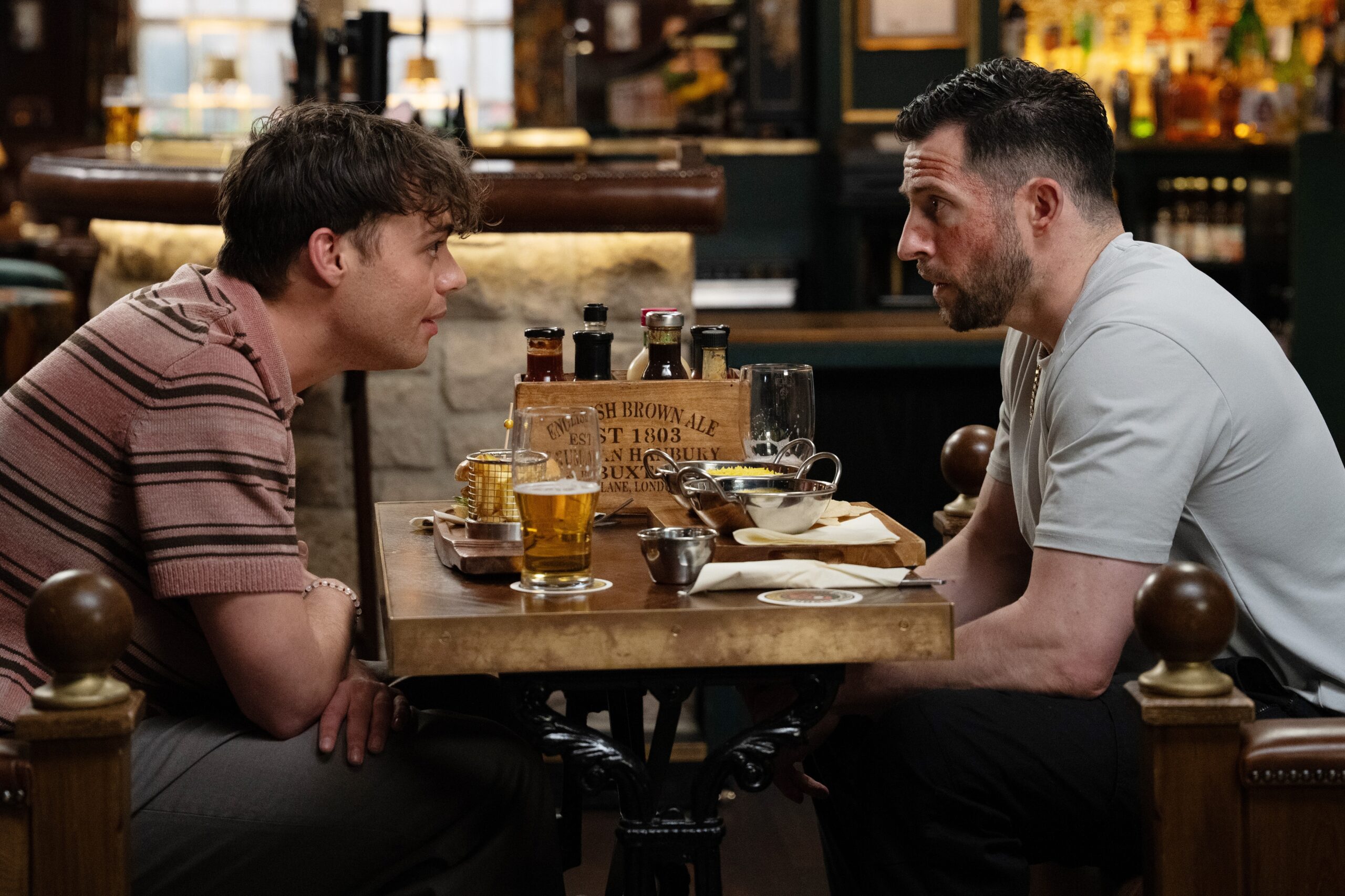 Emmerdale's Lewis and Ross talking in the Woolpack