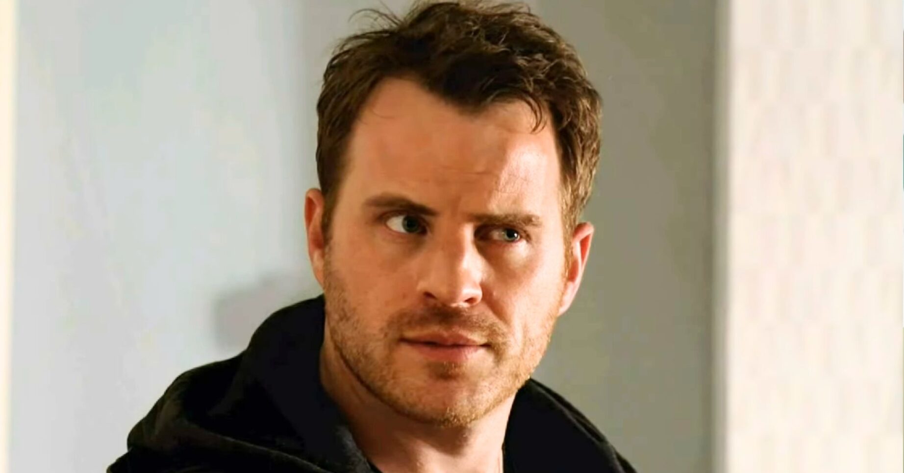 Sean Slater with one eyebrow raised on EastEnders (Credit: BBC/Composite: ED!)