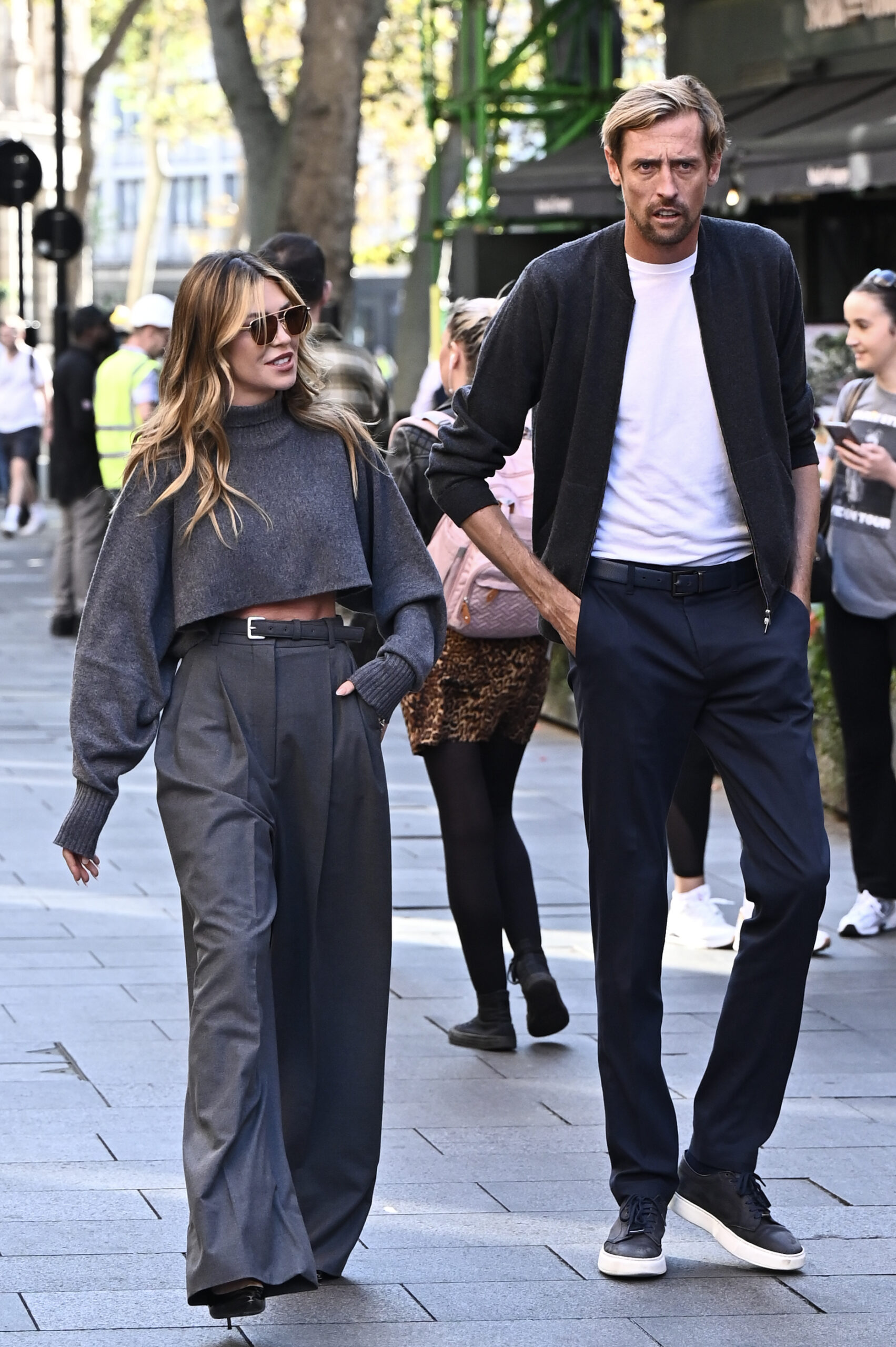 Abbey Clancy and Peter Crouch walking side-by-side 