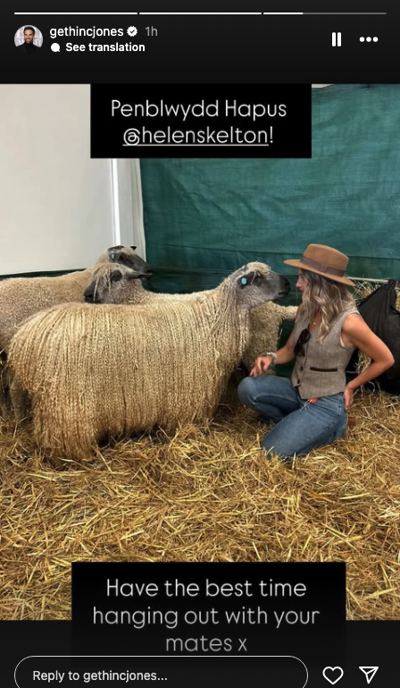 Helen Skelton with some sheep on a farm