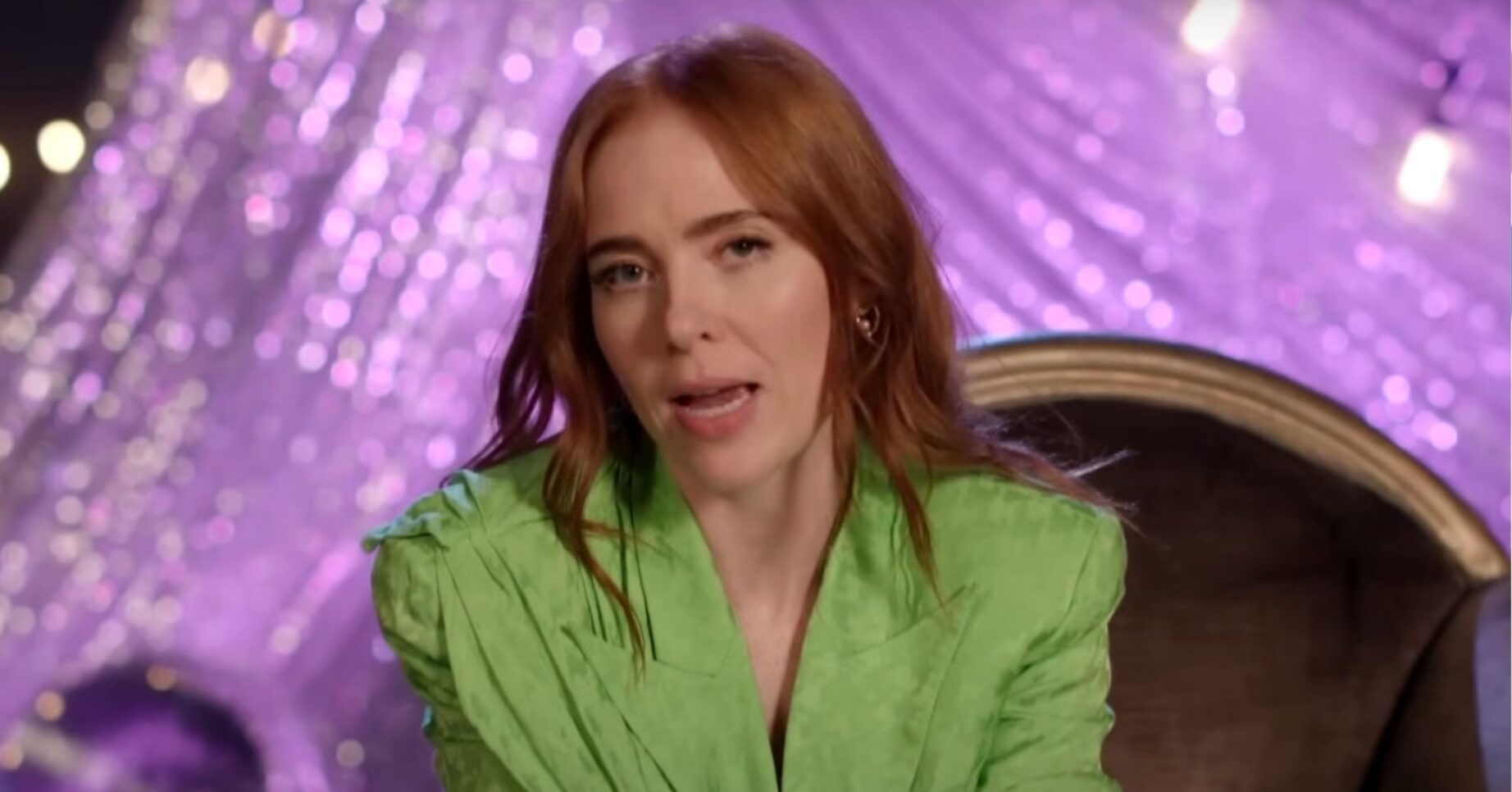 Angela Scanlon speaking to camera in a green dress