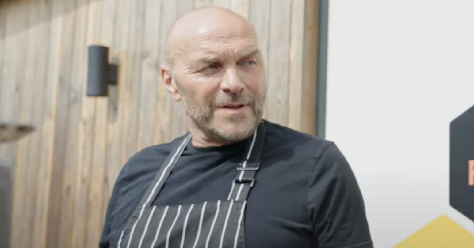 Simon Rimmer outside wearing a chef's apron