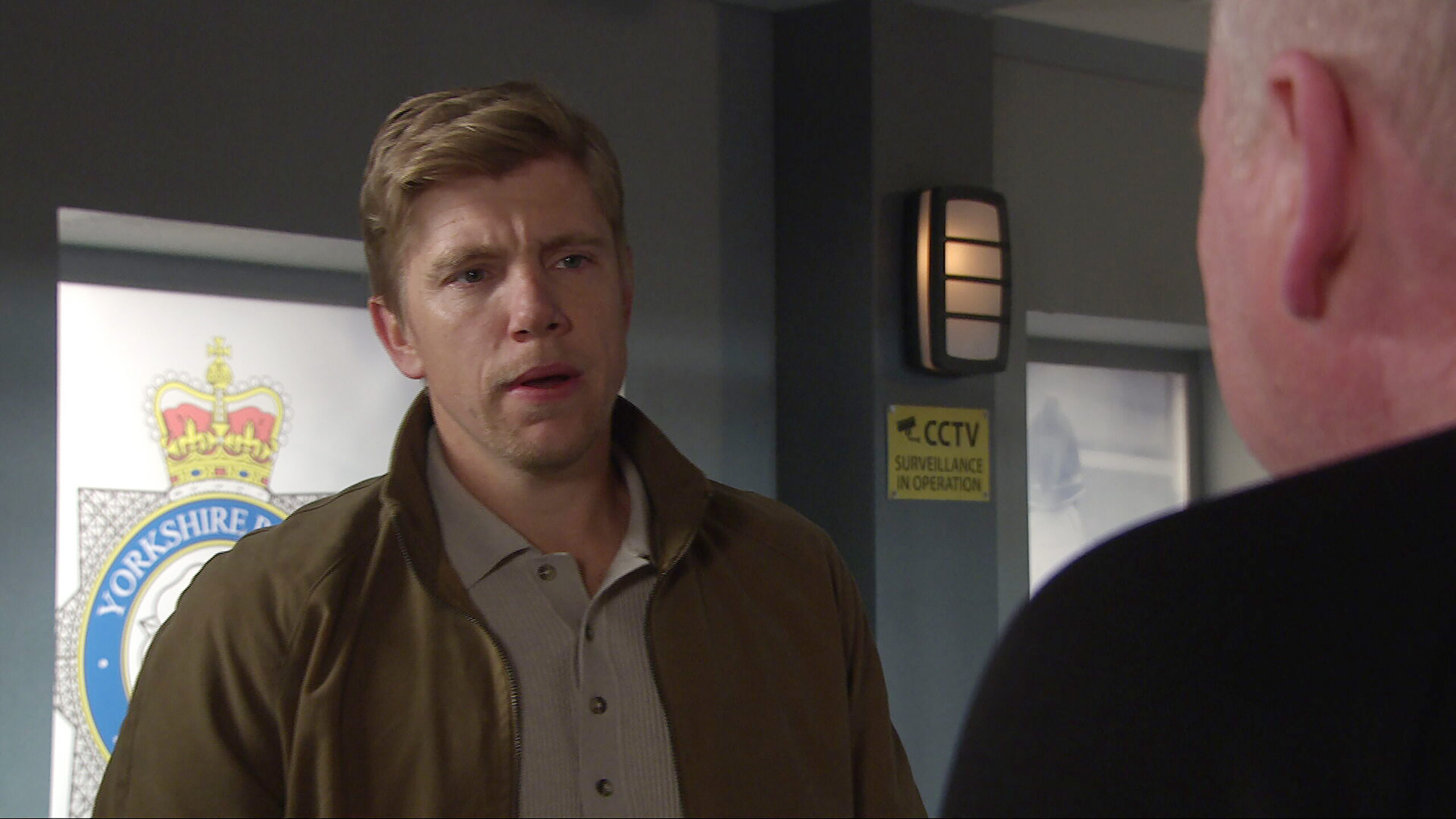 Robert at the police station in Emmerdale