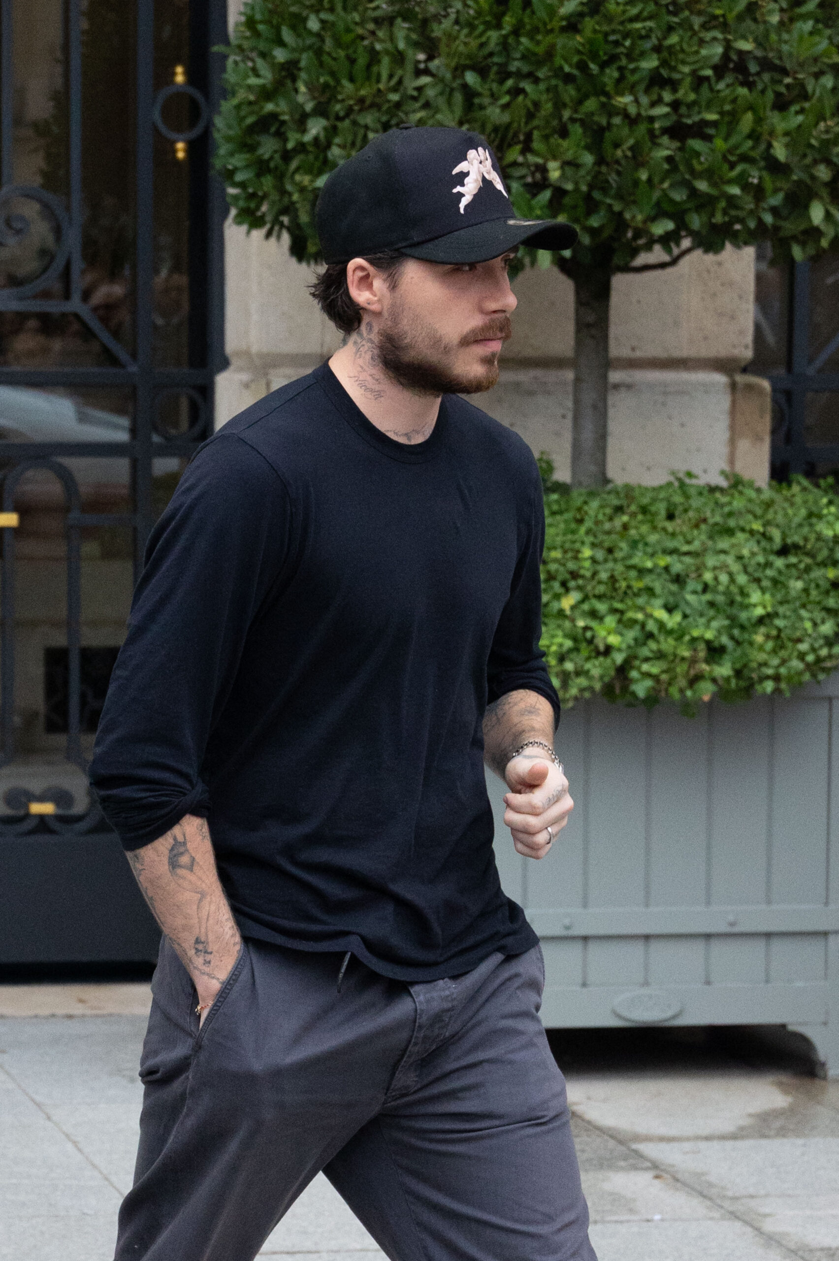 Brooklyn Beckham walking outside 