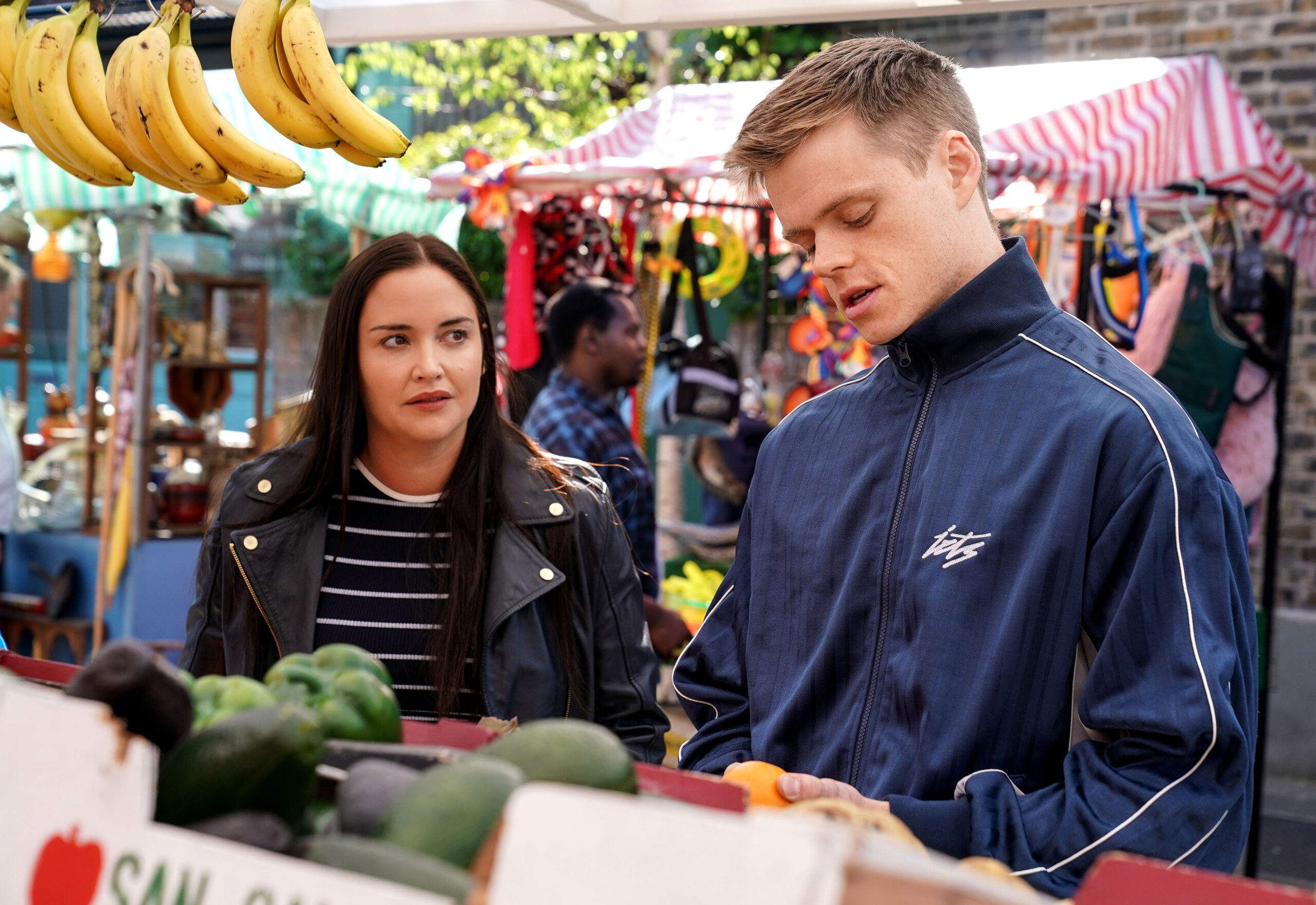 Oscar and Lauren talk at the fruit and veg stall on EastEnders