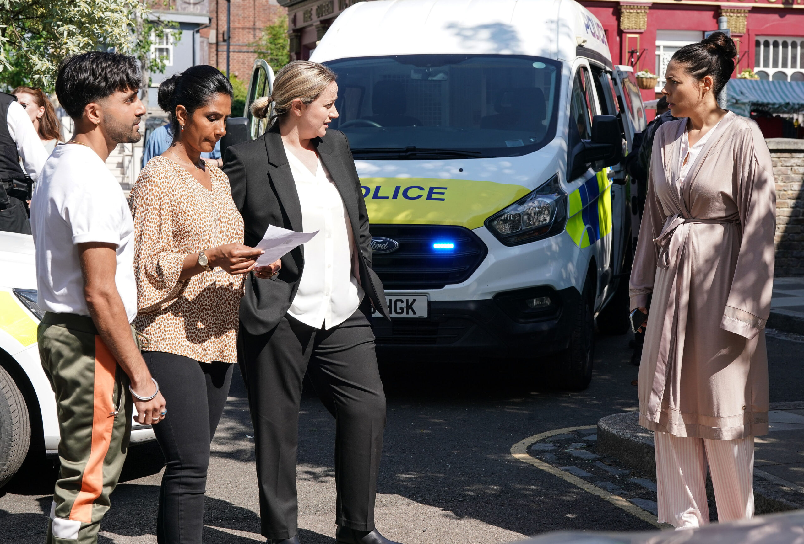 The police outside the Panesar home with Suki and Priya