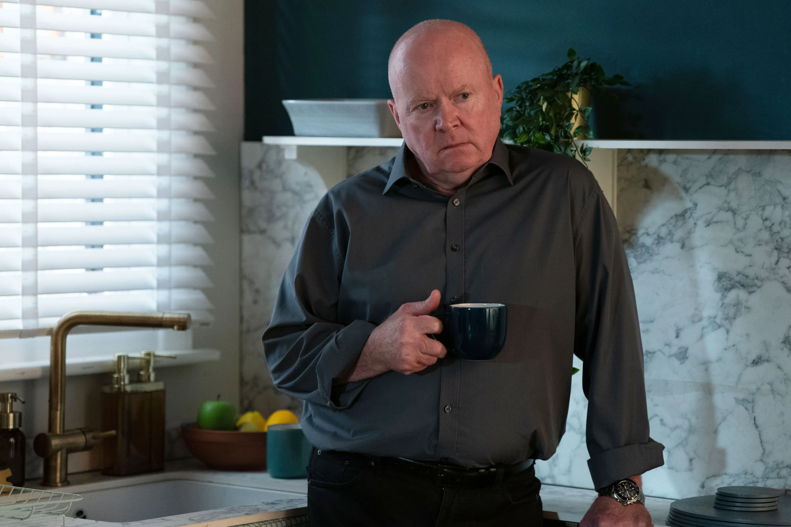 Phil looks angry on EastEnders