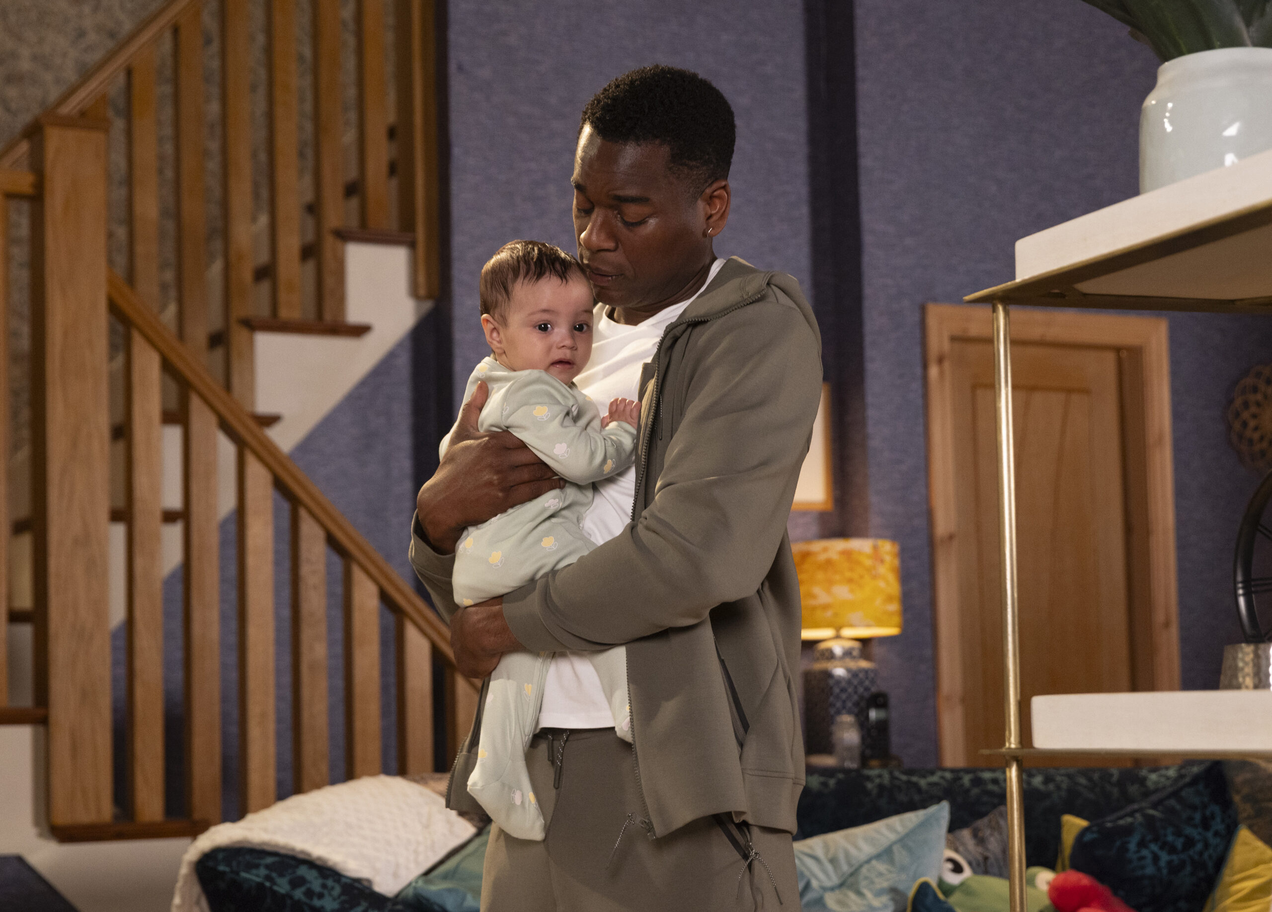 James holding baby Laila in Coronation Street