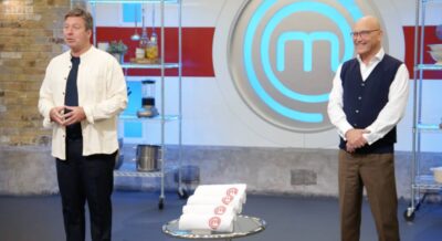 John Torode standing alongside Gregg Wallace on Masterchef