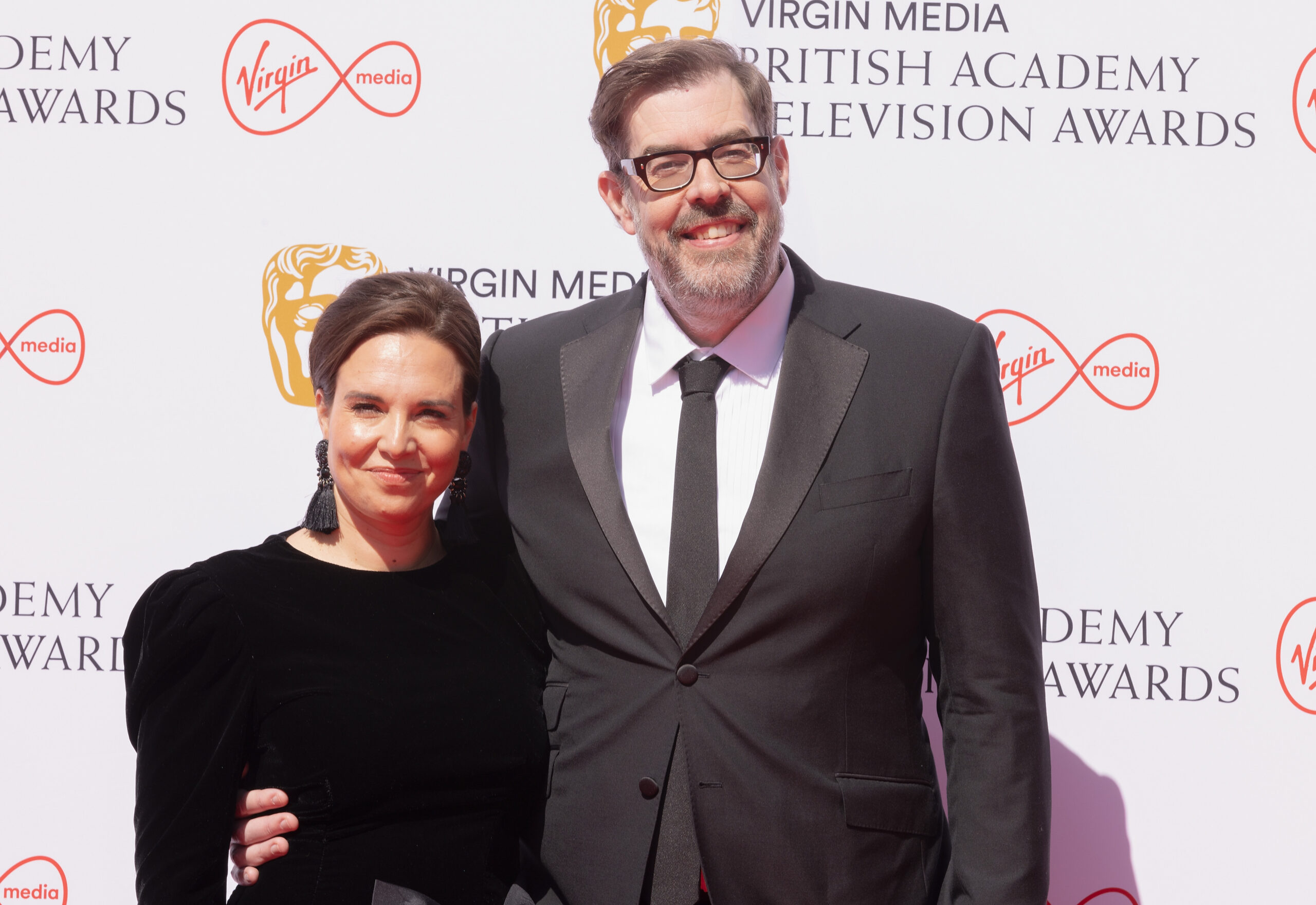 Ingrid Oliver and Richard Osman smiling at the Baftas