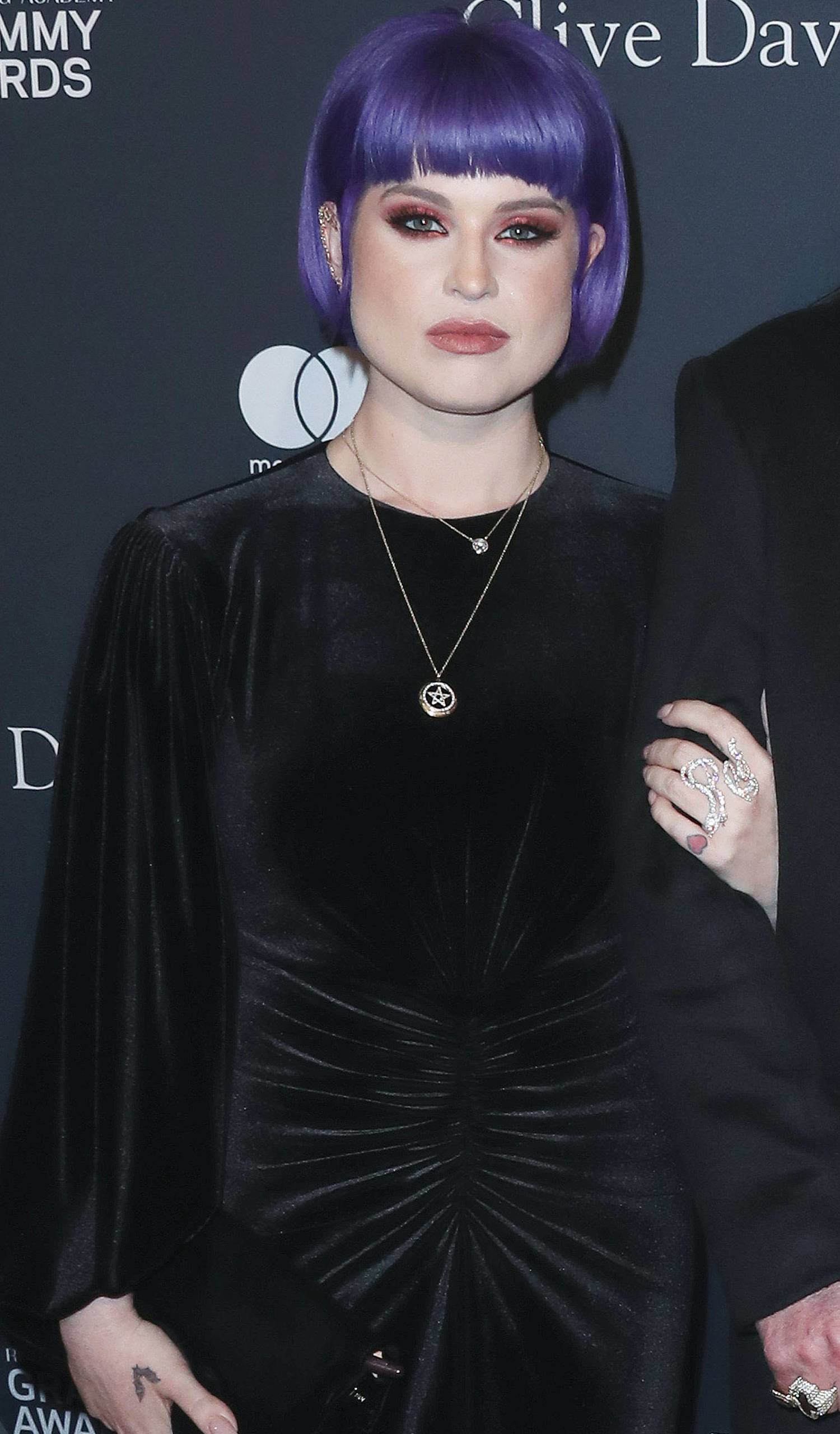 Kelly Osbourne looks at the camera