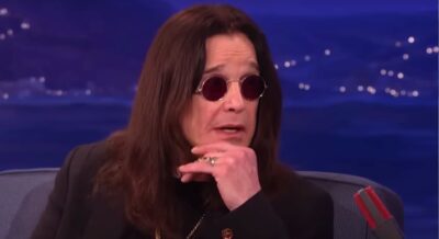 Ozzy Osbourne rests his chin on his hand