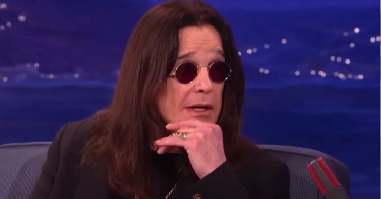 Ozzy Osbourne rests his chin on his hand