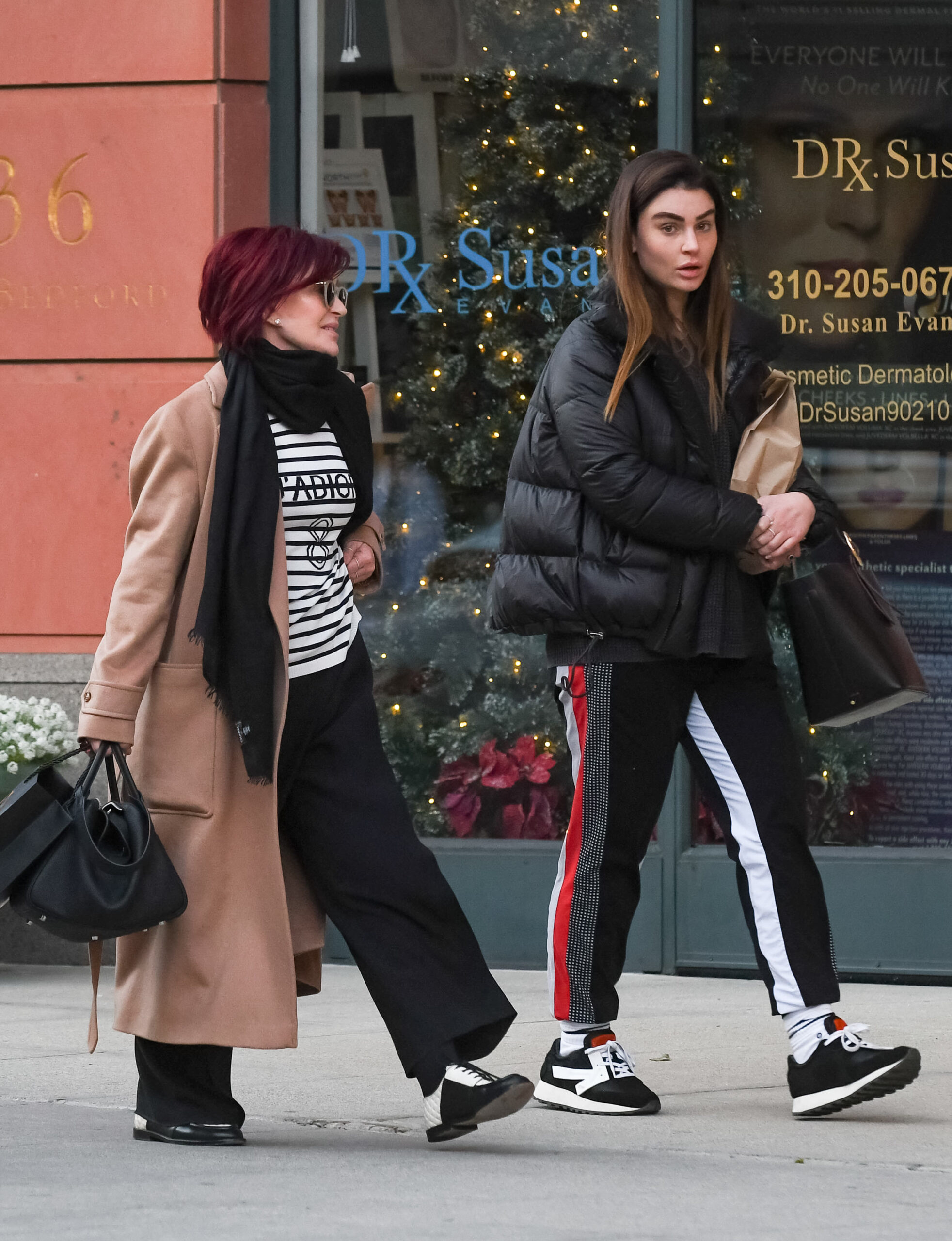 Sharon Osbourne and Aimee Osbourne walking