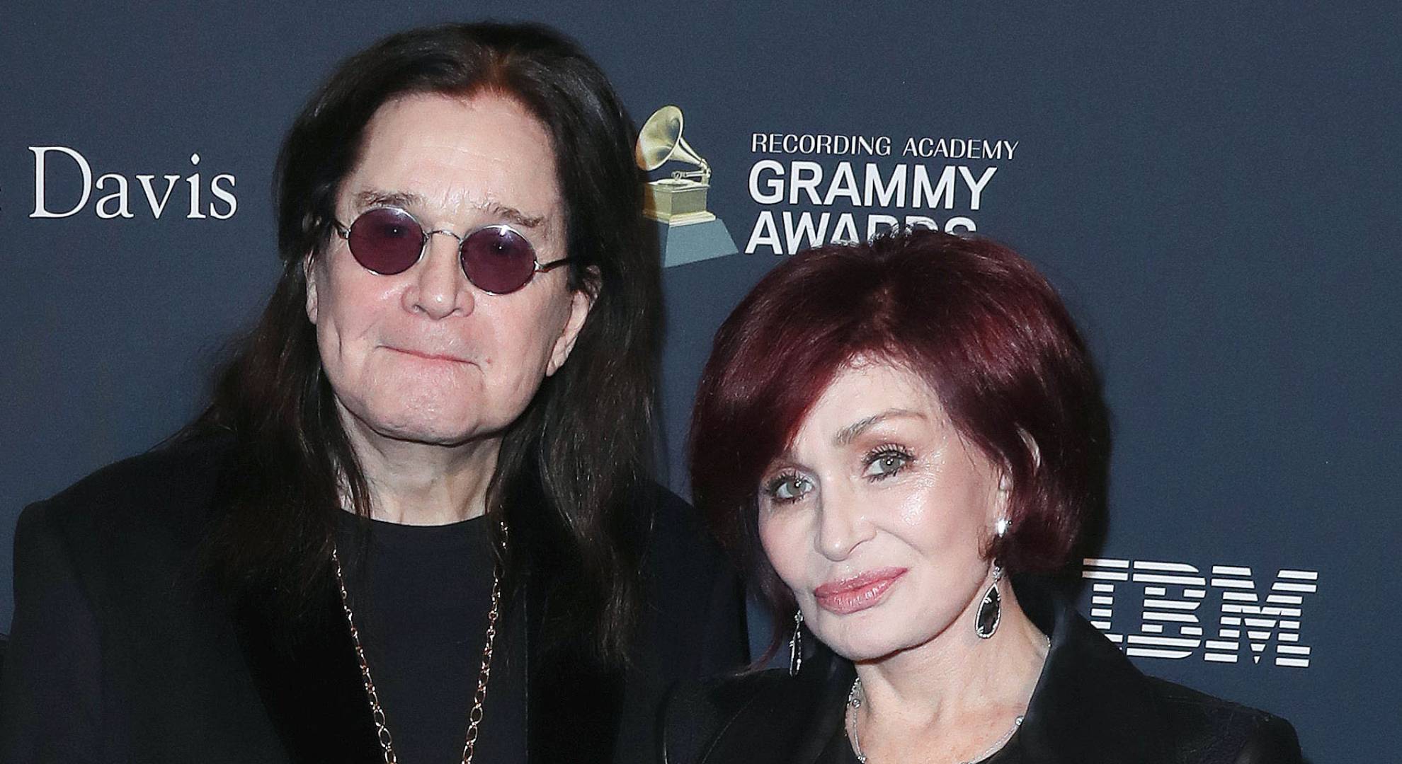 Ozzy Osbourne standing with wife Sharon