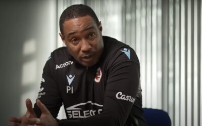 Paul Ince sitting at a desk talking to camera