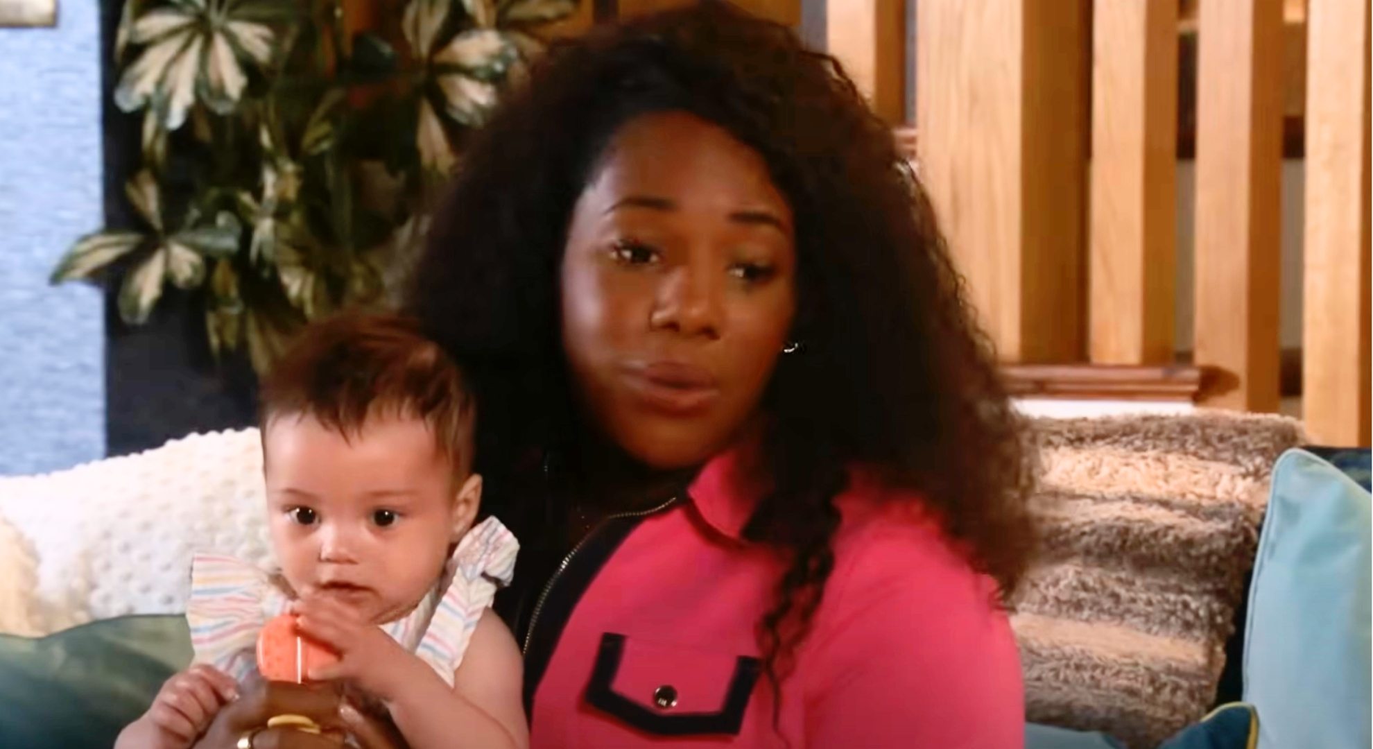 Coronation Street's Dee-Dee holding baby Laila