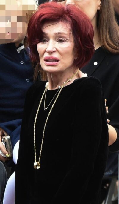 Sharon Osbourne wears a ring on a necklace