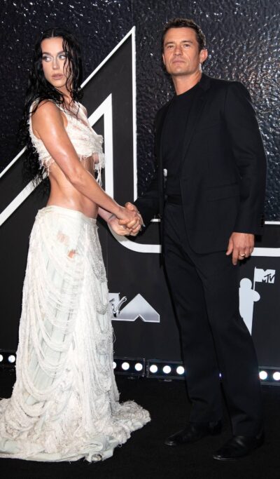 Katy Perry holds hands with Orlando Bloom