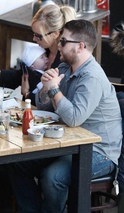 Jack Osbourne sitting with Kimberly Stewart
