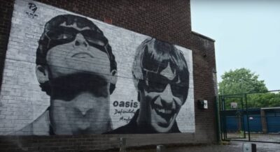 An Oasis mural on a wall