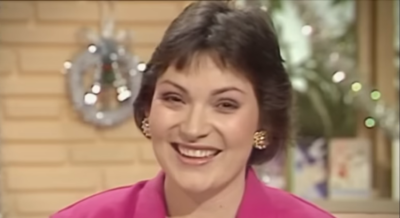 Old photo of Lorraine Kelly presenting Lorraine