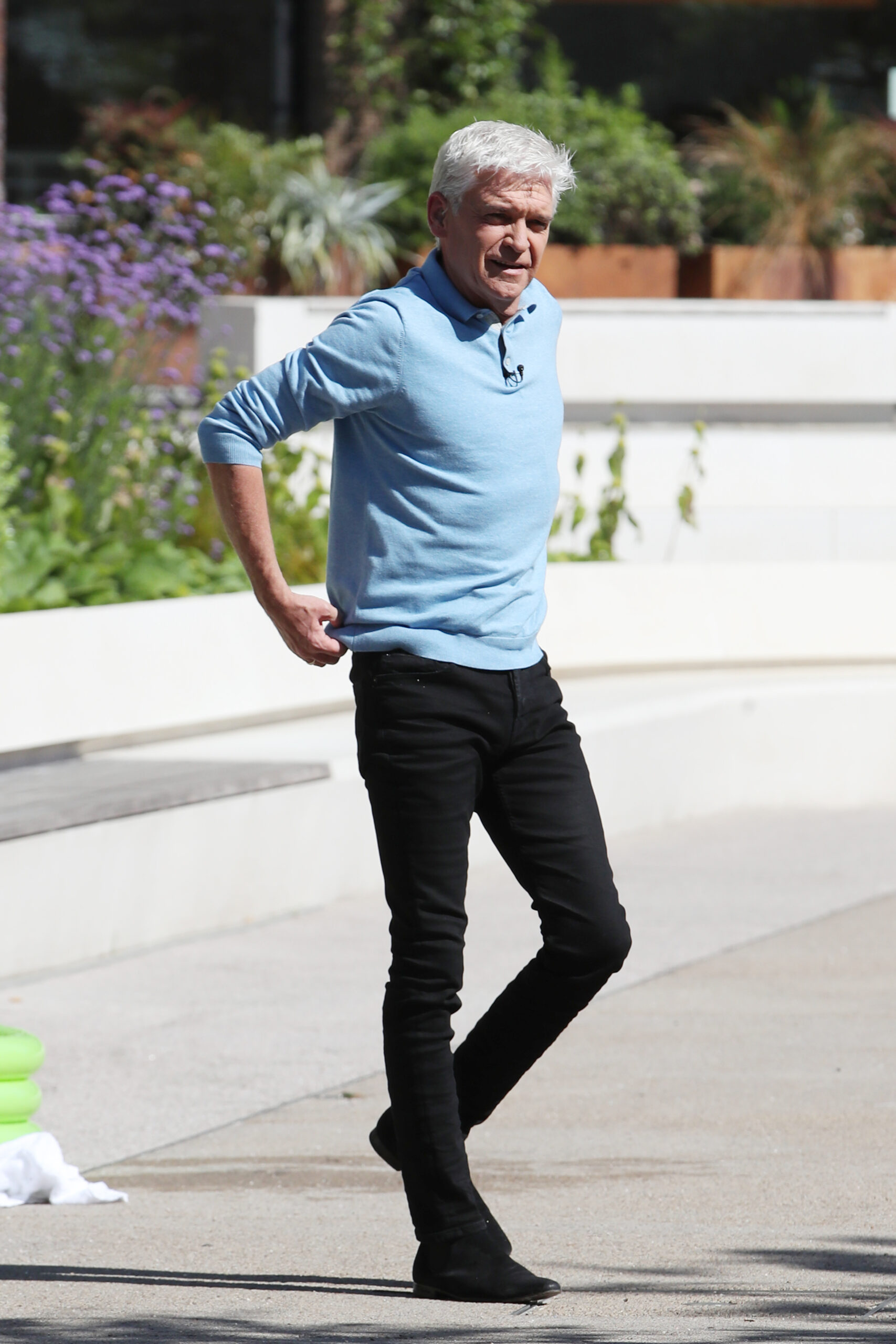 Phillip Schofield in a blue shirt and black jeans