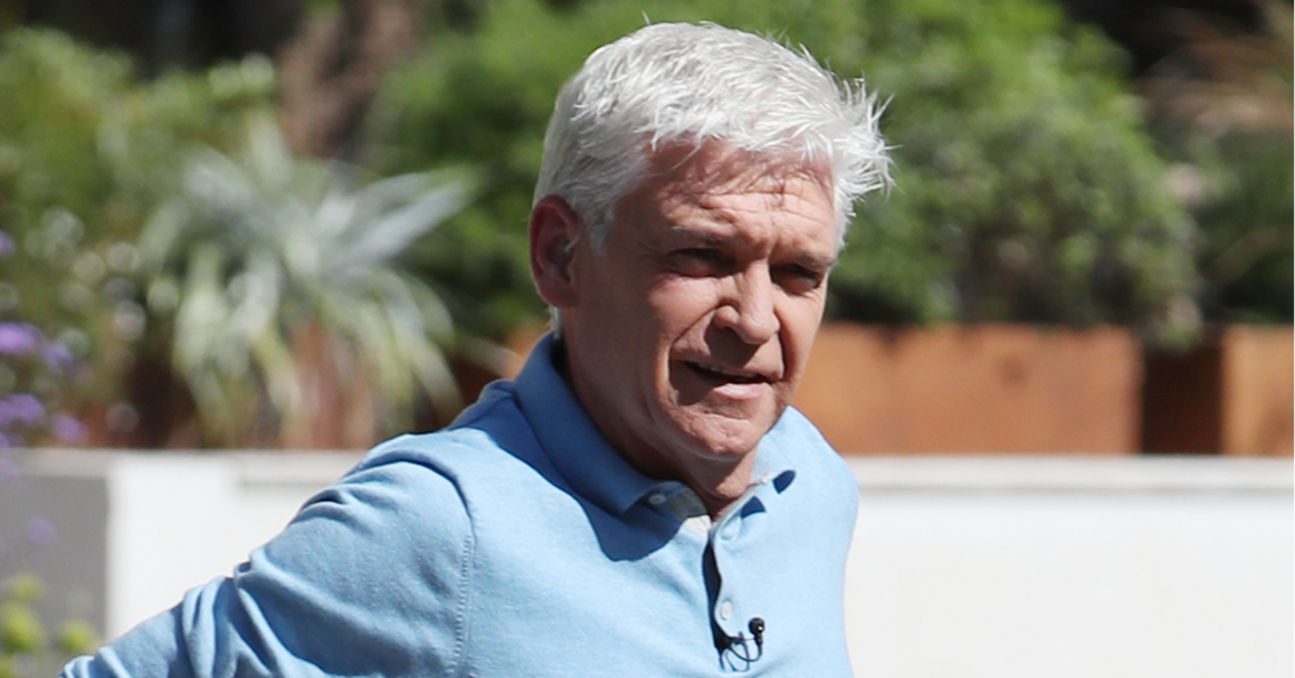 Phillip Schofield in the sunshine in a blue polo shirt