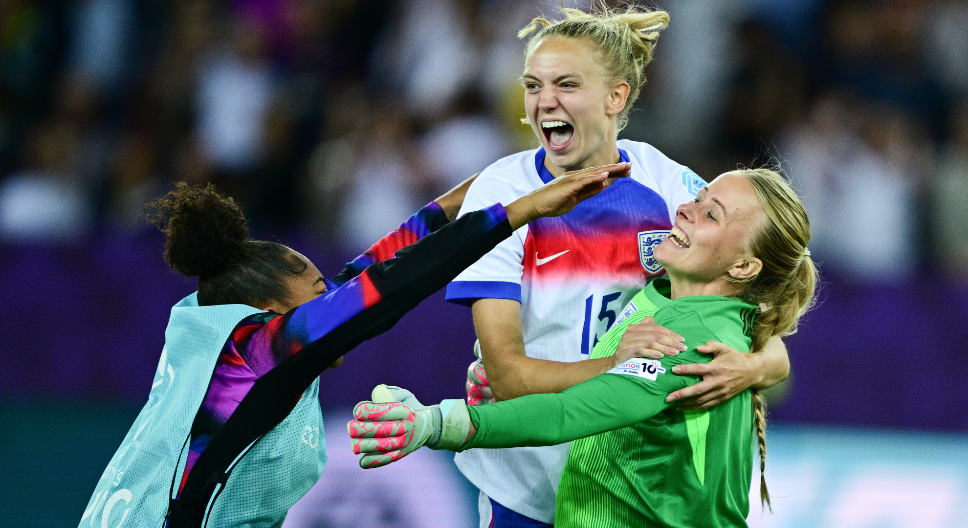 Hannah Hampton celebrating the Lionesses' victory with Khiara Keating and Esme Morgan