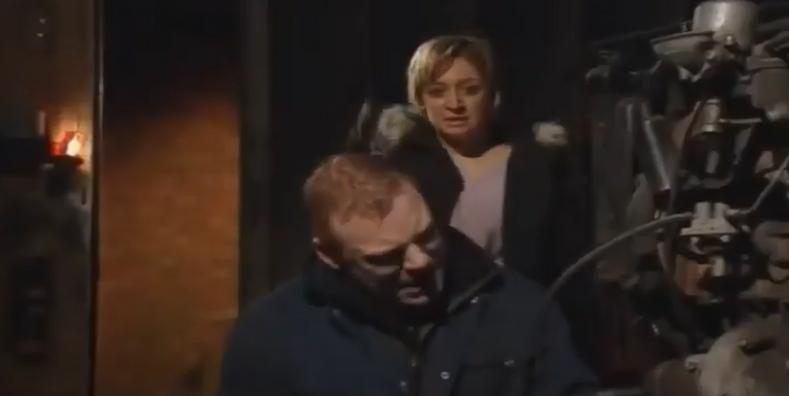 Katy stands behind dad, Tommy, ready to strike.