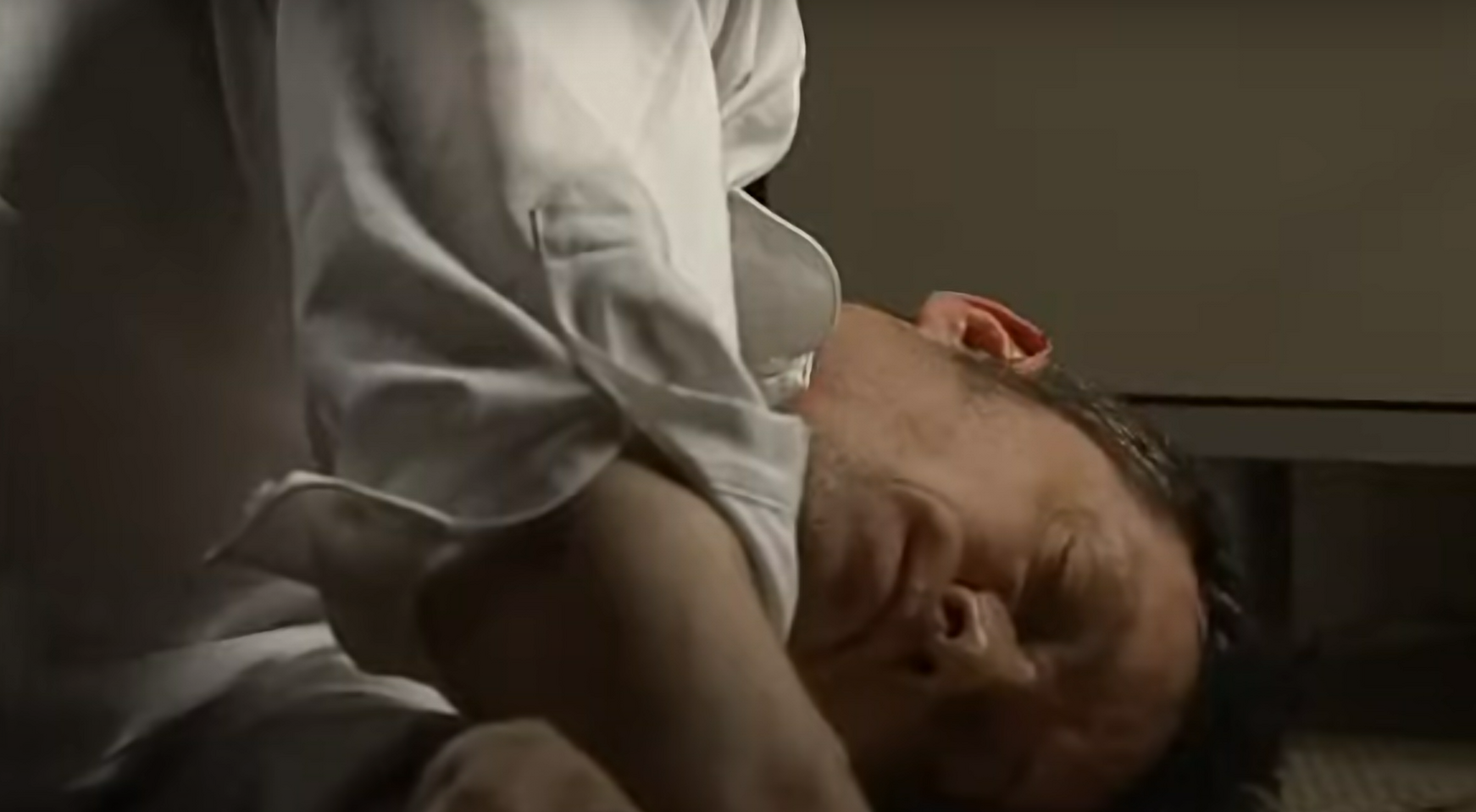 Charlie Stubbs lays on the ground after being hit over the head.