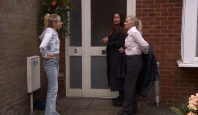 Betsy, Carla and Lisa outside number 6 Coronation Street.