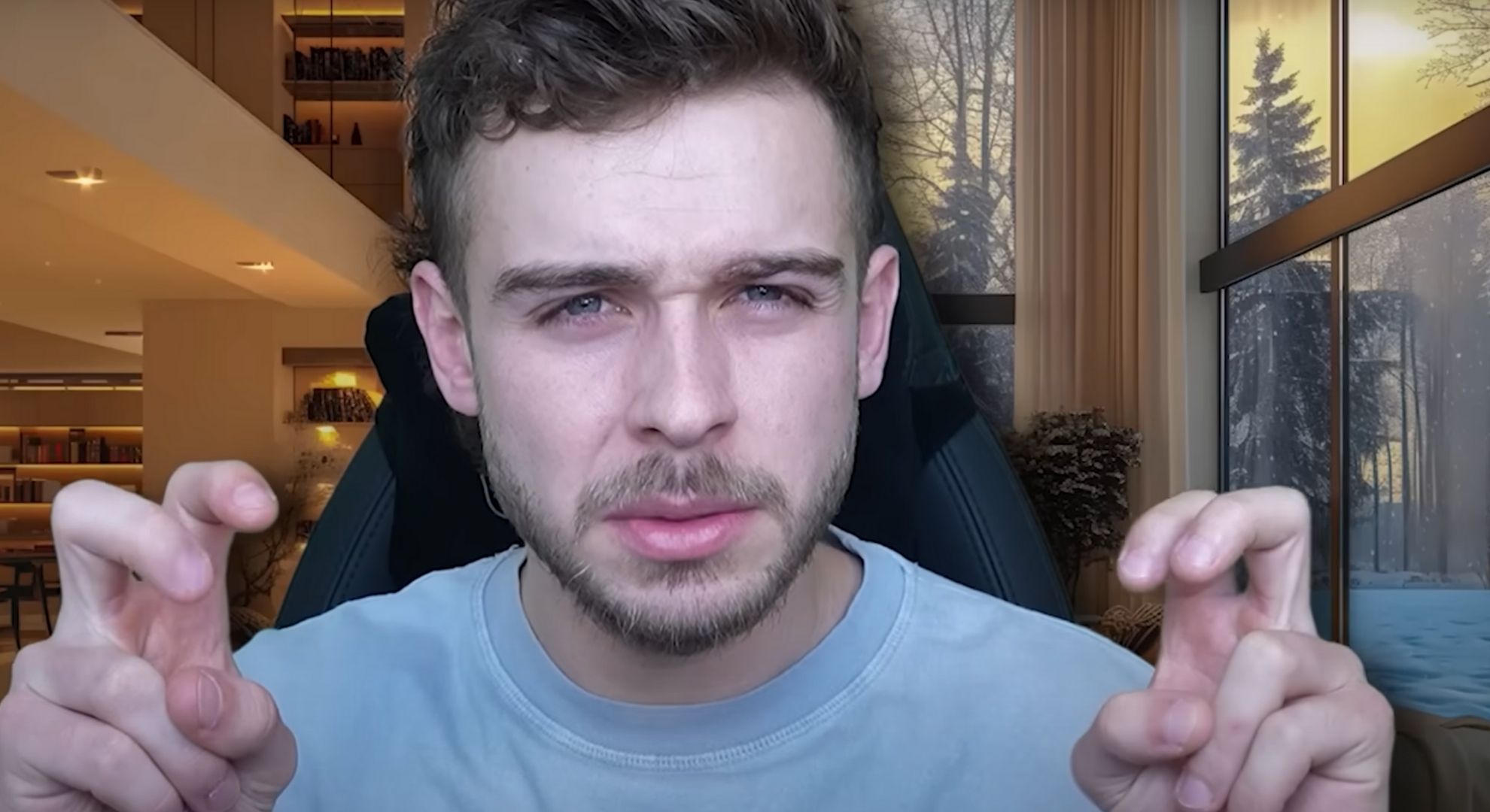 George Clark making air quotes in a YouTube video.