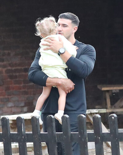 Tommy Fury holding Bambi