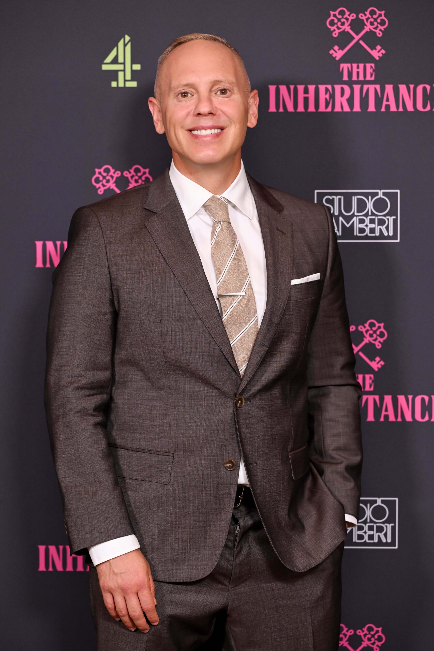 Rob Rinder smiling on the red carpet