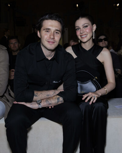 Brooklyn Beckham and Nicola Peltz posing and smiling.