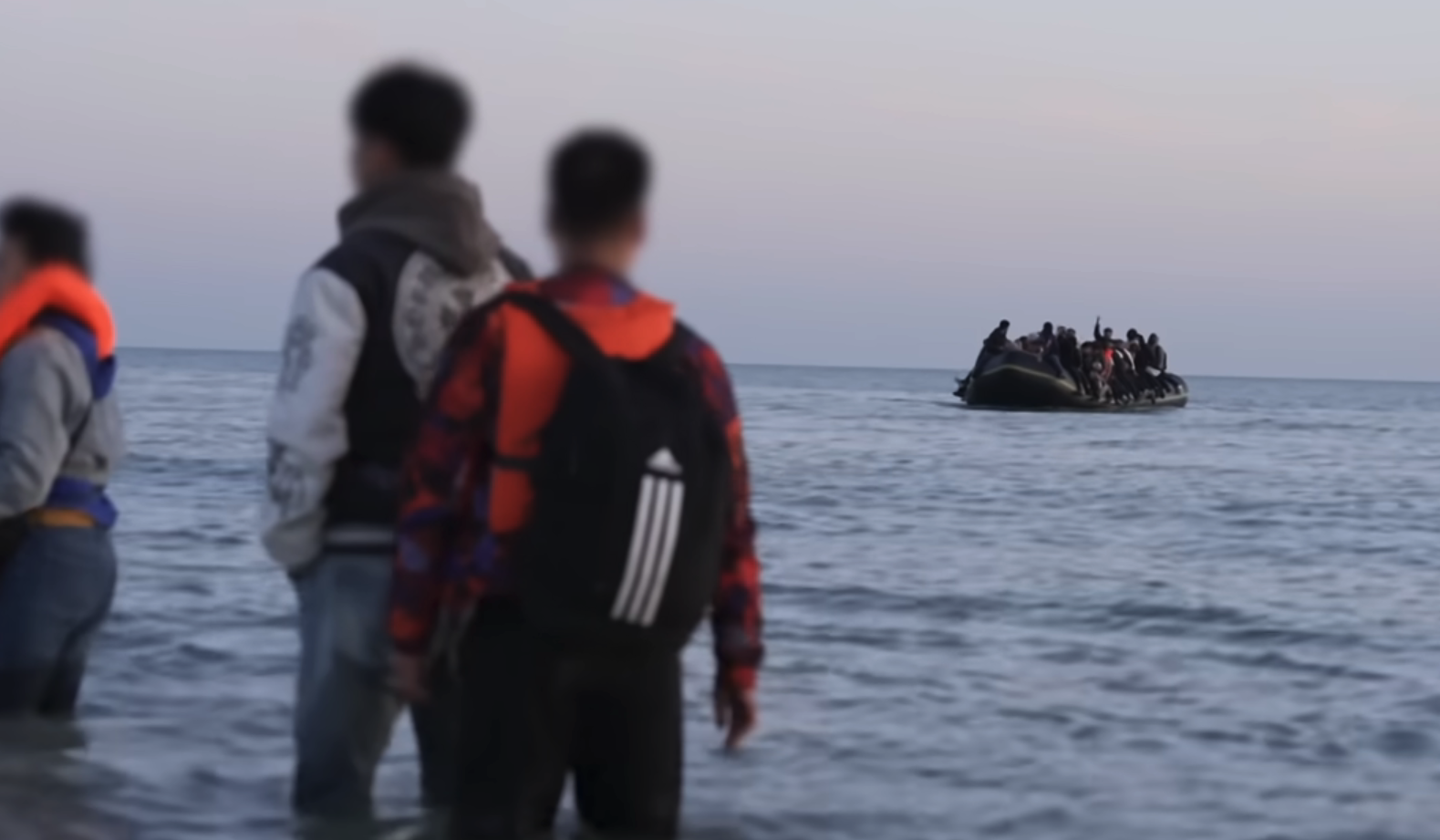 A small boat crossing the channel
