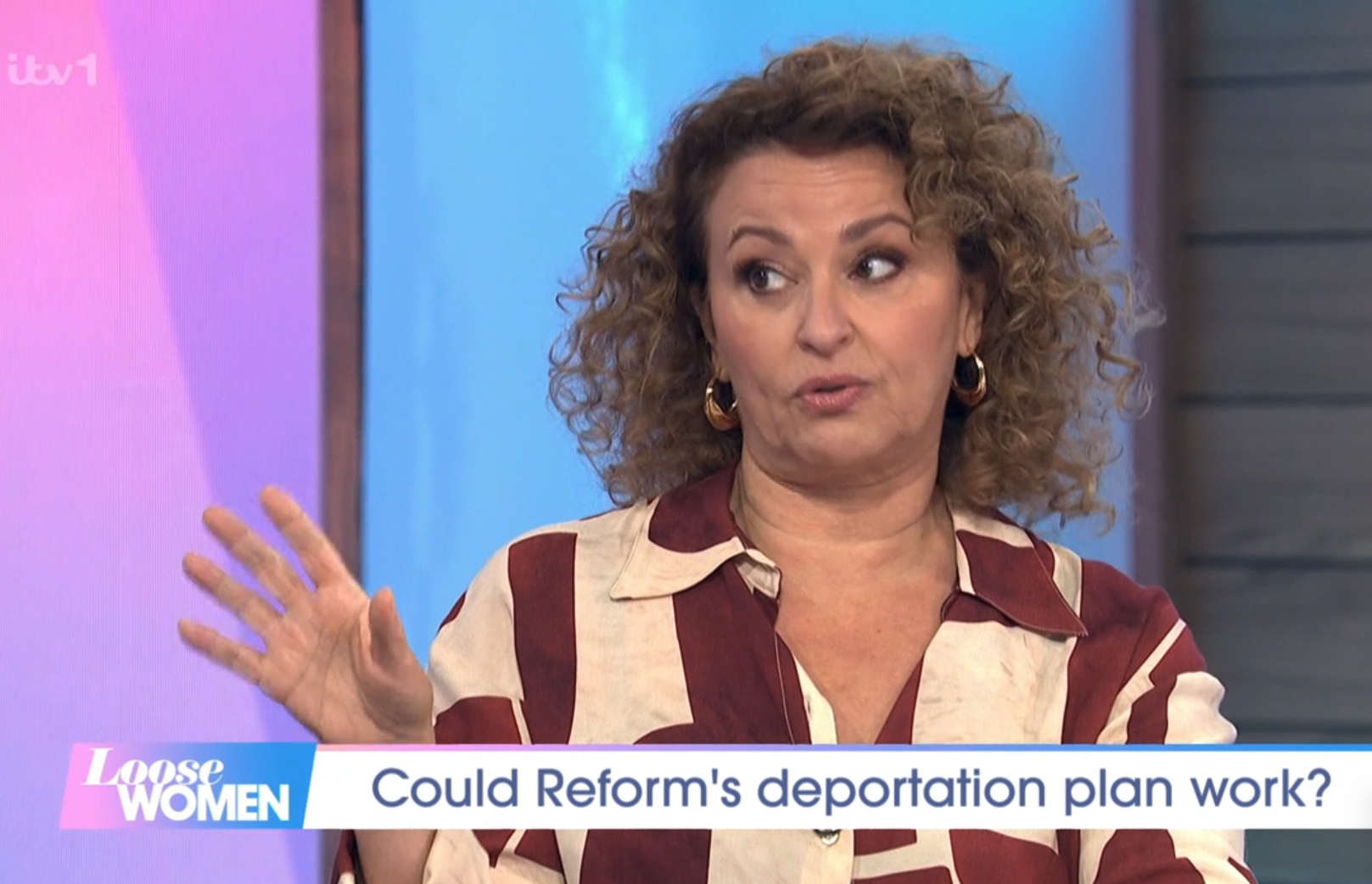 Nadia Sawalha raising her hand on Loose Women