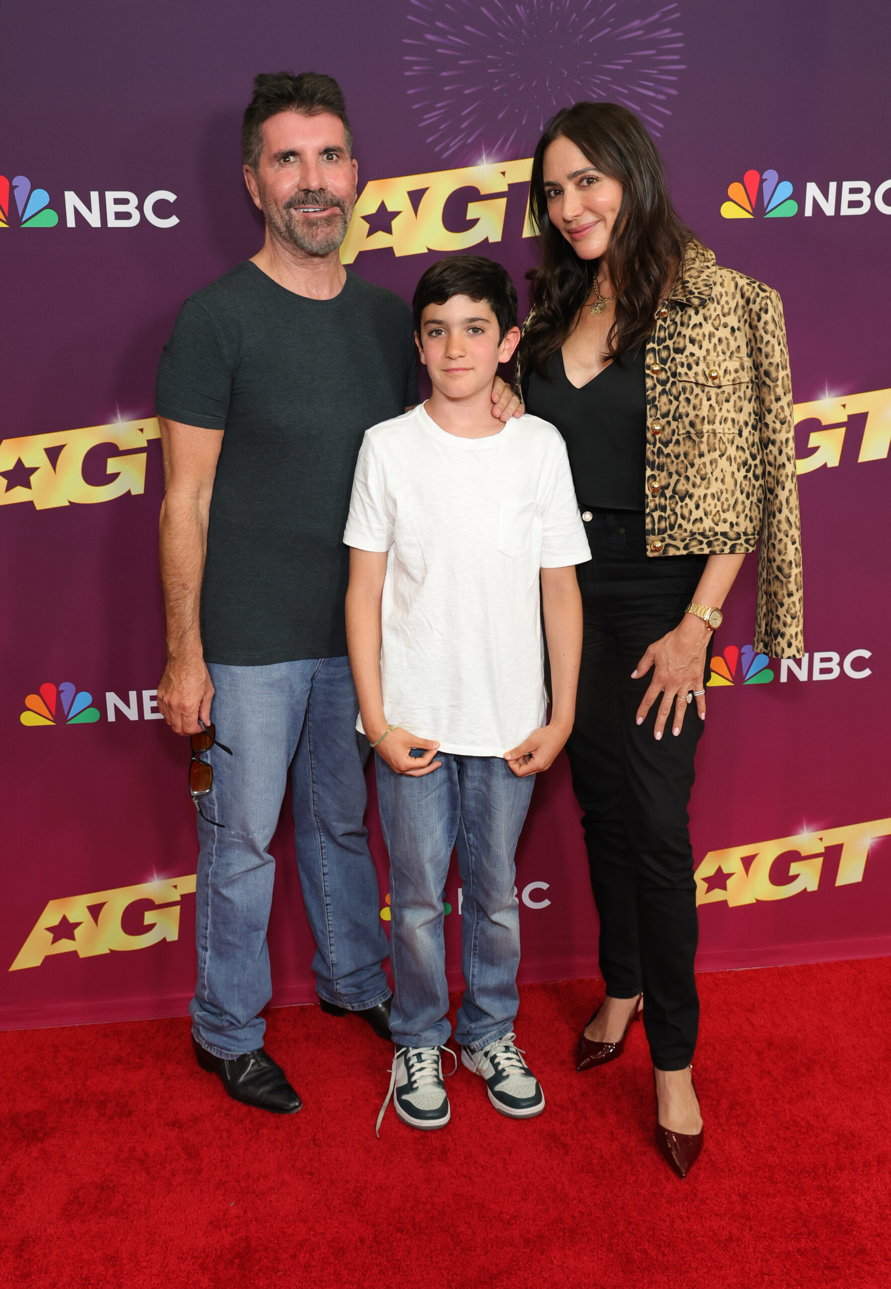 Simon Cowell with son and partner at event