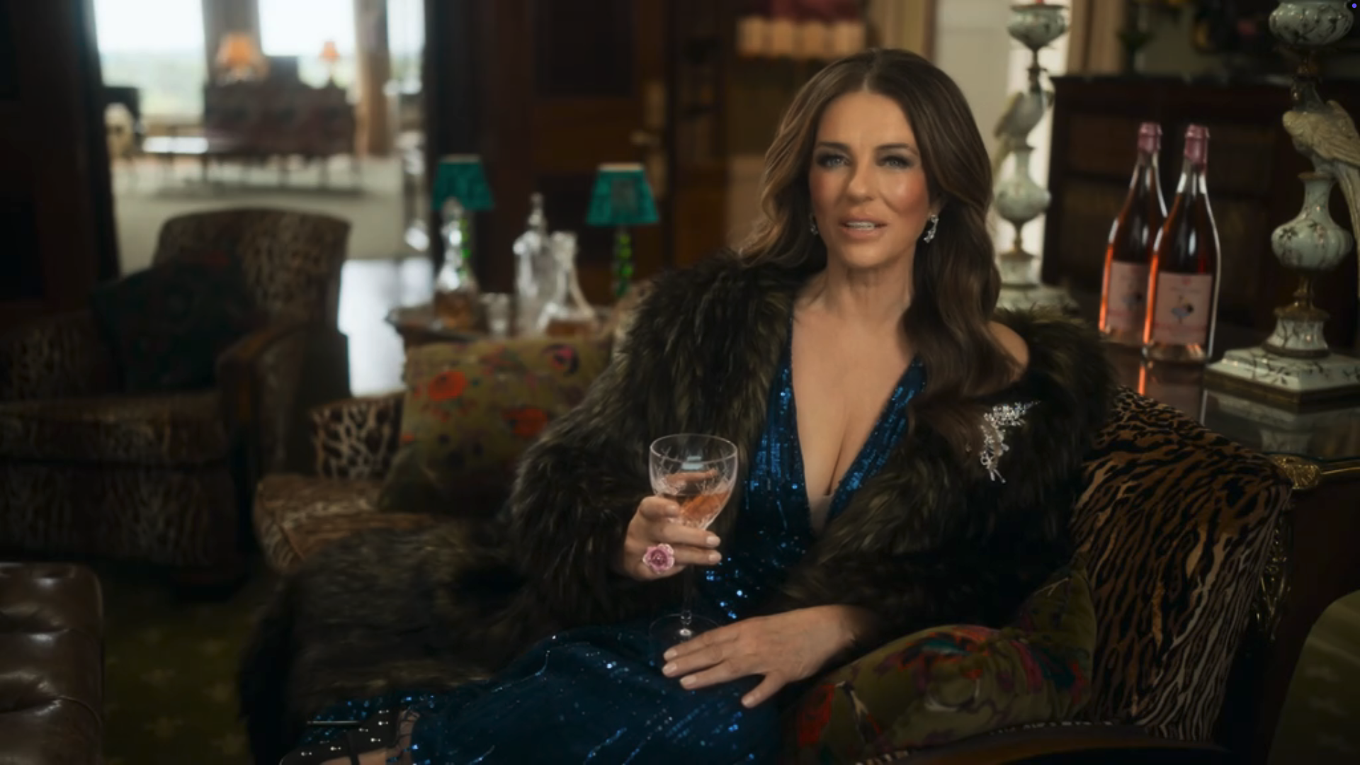 Elizabeth Hurley with a glass of wine on The Inheritance