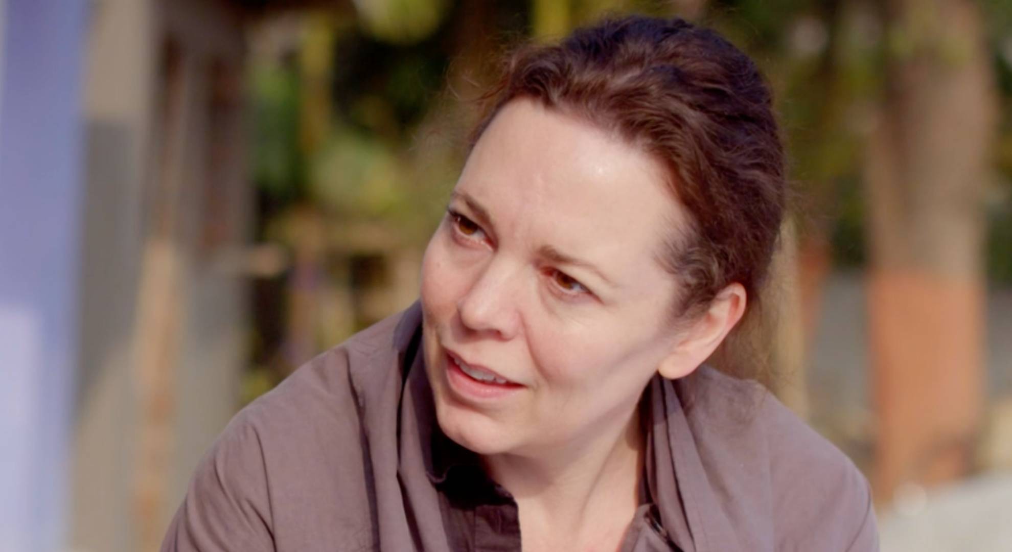 Olivia Colman listens