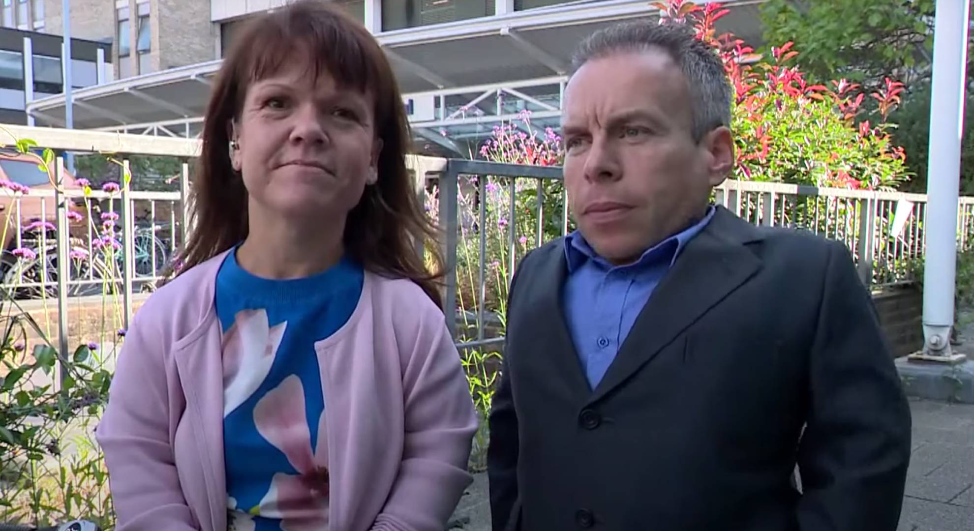 Warwick Davis standing next to his late wife