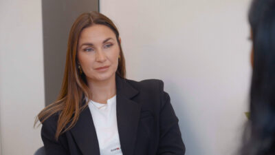 Sam Faiers looking straight faced in a black jacket