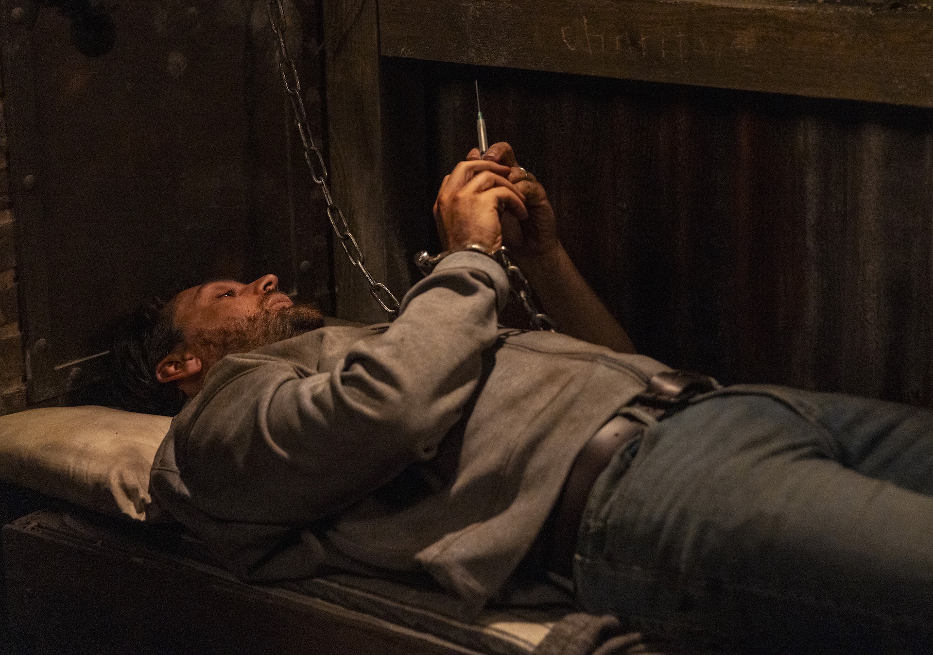 Mackenzie looks at the syringe in the bunker (Credit: ITV)