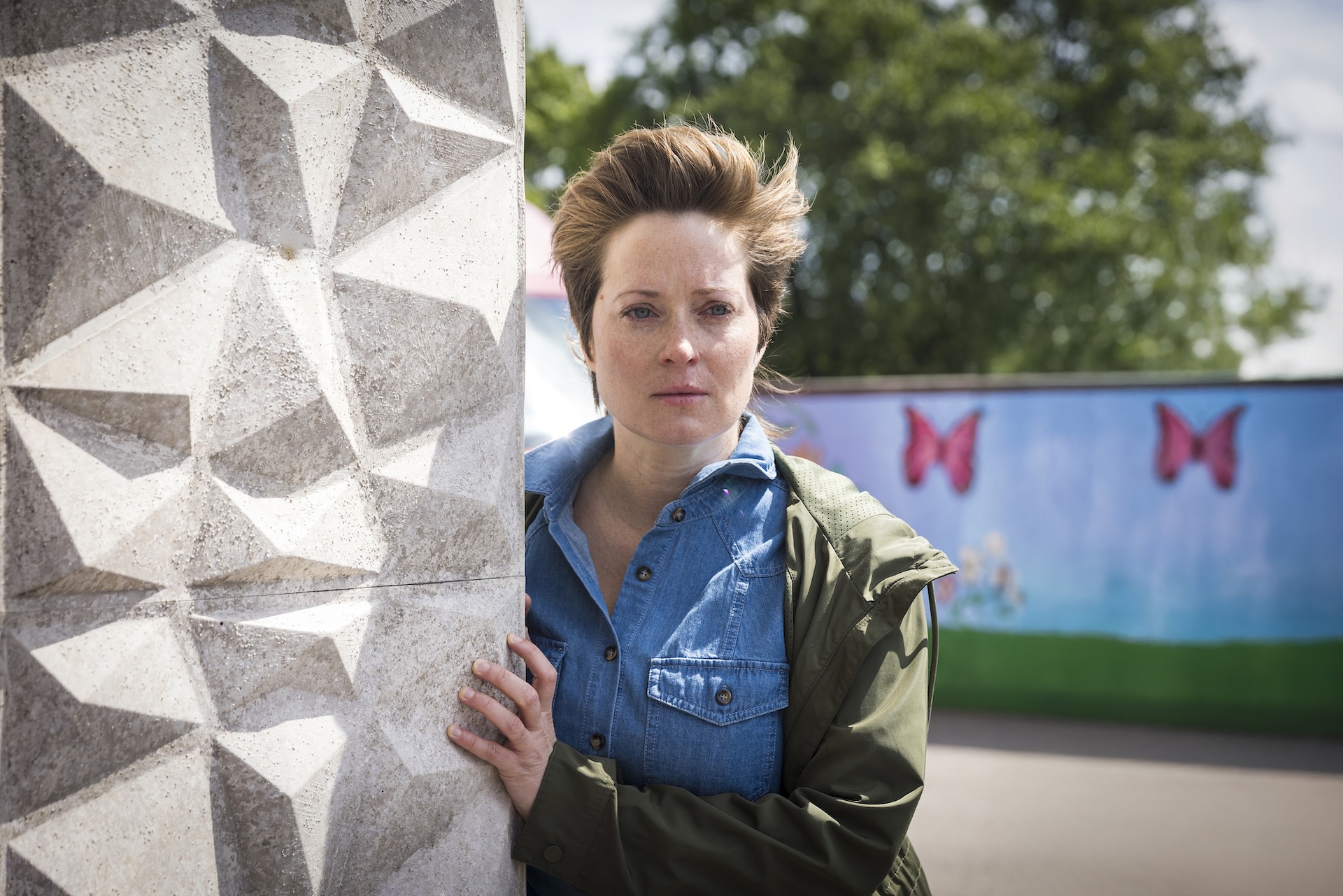 Mystery woman lurking around a corner in Coronation Street