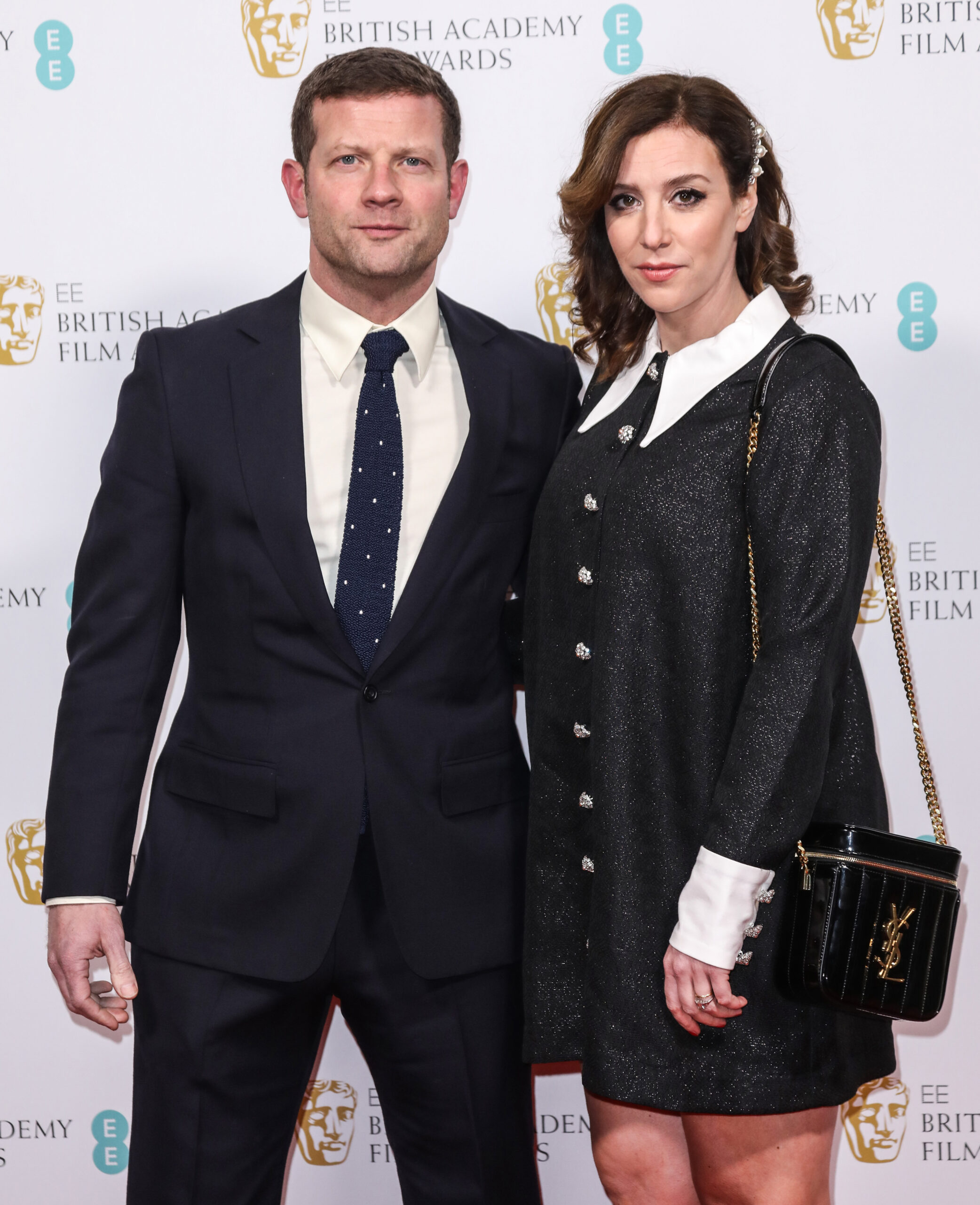 Dermot and his wife looking serious