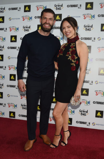 Kelvin and his wife Liz posing on red carpet